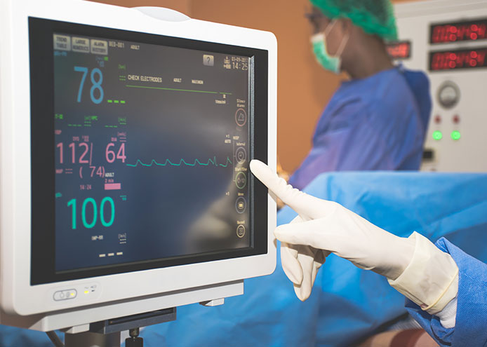 The monitor of an Electrocardiogram (ECG) in a medical room.