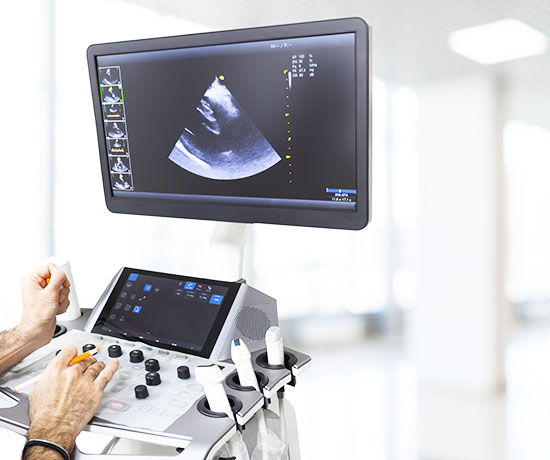 A medical professional monitoring the Transesophageal Echocardiogram.