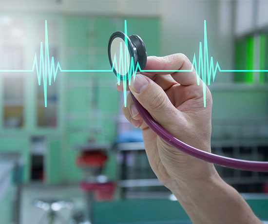 Close-up shot of a medical expert showing a stethoscope with pulse signals.