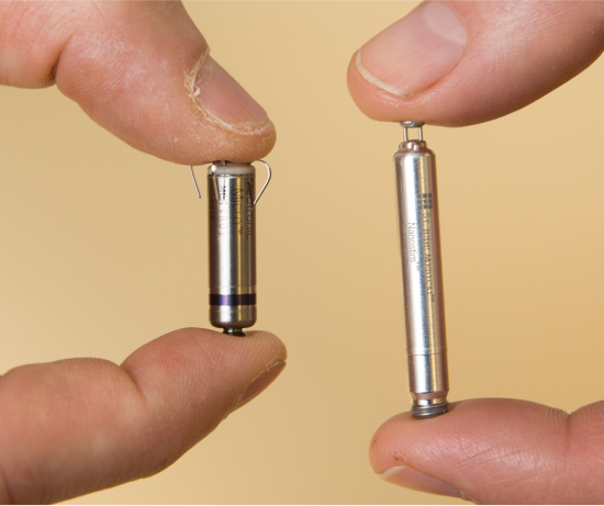 Leadless pacemakers of different sizes.