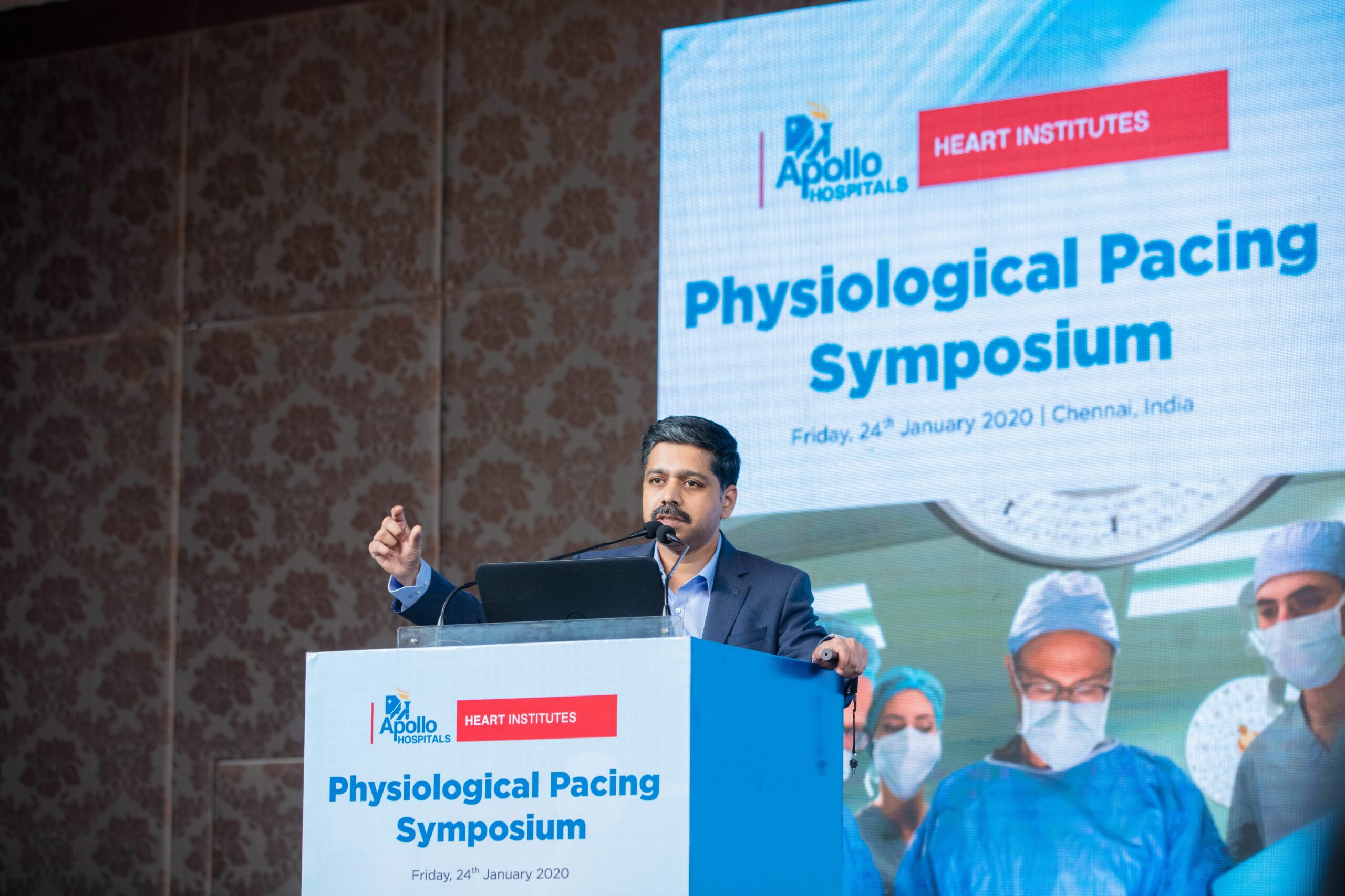 Photo of Dr. Karthigesan A.M. addressing a gathering at the Physiological Pacing Symposium.