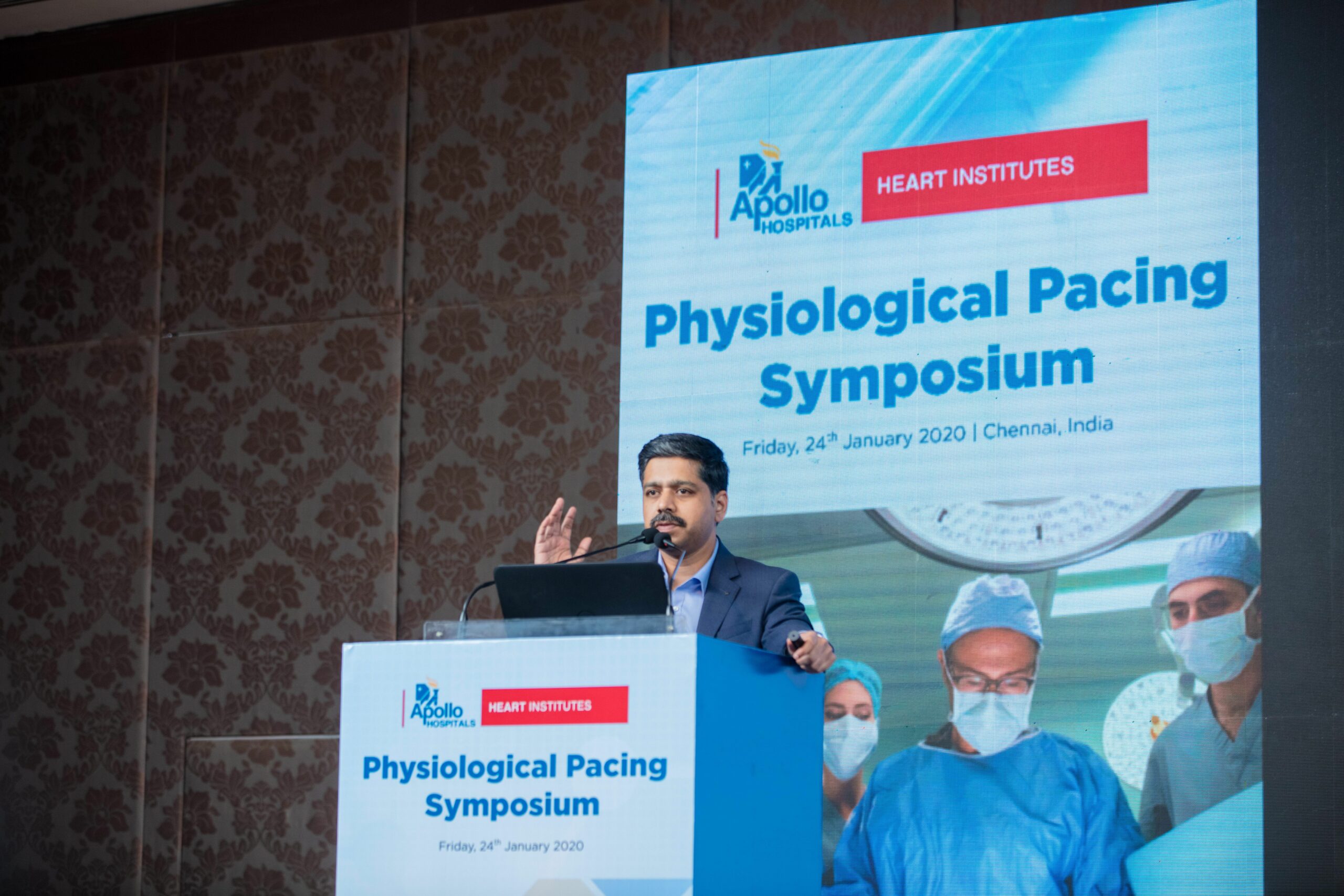 Photo of Dr. Karthigesan A.M. addressing a gathering at the Physiological Pacing Symposium.
