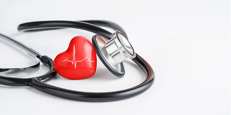 Picture of a red heart and stethoscope illustrates understanding & maintaining hearth rhythm for healthy heart.
